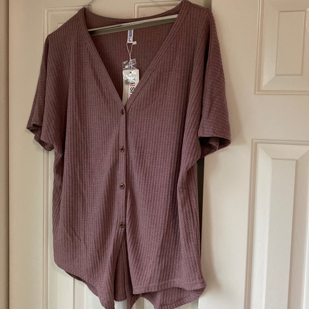 V- neck button from thermal short sleeve with tie front.